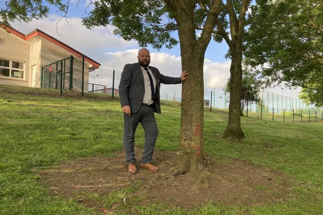Armagh, Banbridge and Craigavon Councillor Mark Baxter at an Ash tree in Donaghcloney which has been earmarked from axing. It is one of 137 trees in the Co Armagh area which has been infected with a deadly fungus and must be chopped down.
