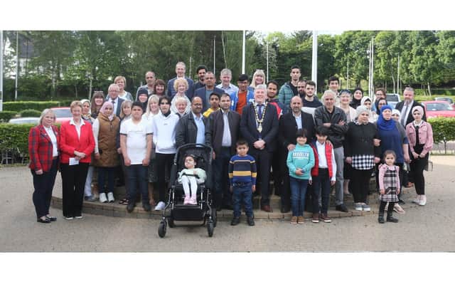 The Mayor of Causeway Coast and Glens Borough Council Councillor Richard Holmes pictured with the group of Syrians during their recent visit to Cloonavin. Also included are volunteer English teachers and Causeway Borough of Sanctuary Committee members