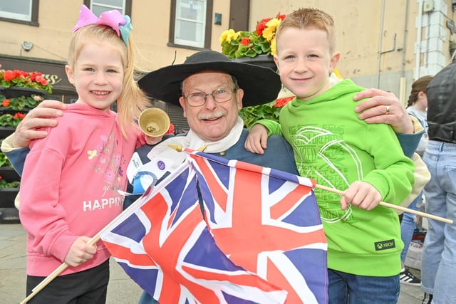 Pictured with Carrick Town Crier Godfrey Robinson are Katie and Alex Trueick.