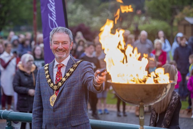 Mayor of Mid and East Antrim, Councillor William McCaughey, with the jubilee beacon in Ballymena.