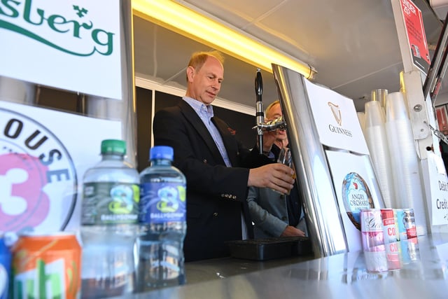 The Earl of Wessex pulls a pint during his visit to Bangor. Photo by Stephen Hamilton / Press Eye.