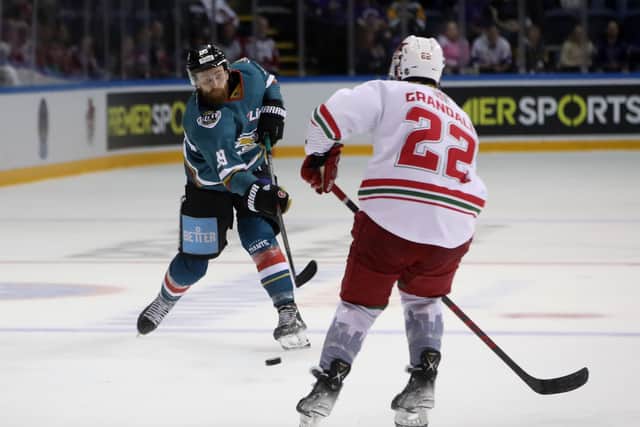 Belfast Giants' Ciaran Long with Cardiff Devils' Justin Crandall at the end of last season. Picture: William Cherry/Presseye