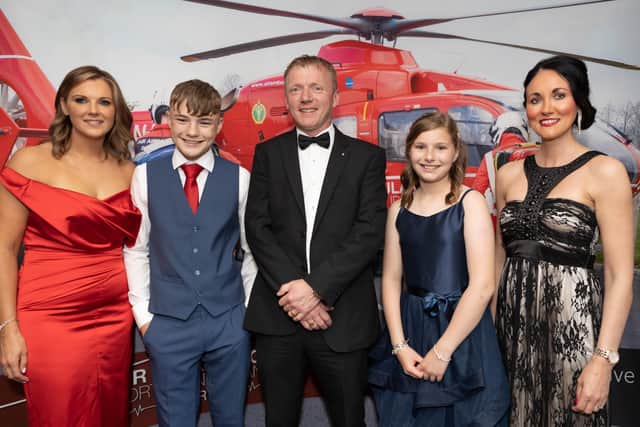Pictured at Ellie’s Red Tie Ball are Caroline Smyth, Harry Smyth, Richard McFetridge from Wilson’s Auctions, Ellie Smyth and Kerry Anderson, Air Ambulance NI. Picture: North Coast Photographer