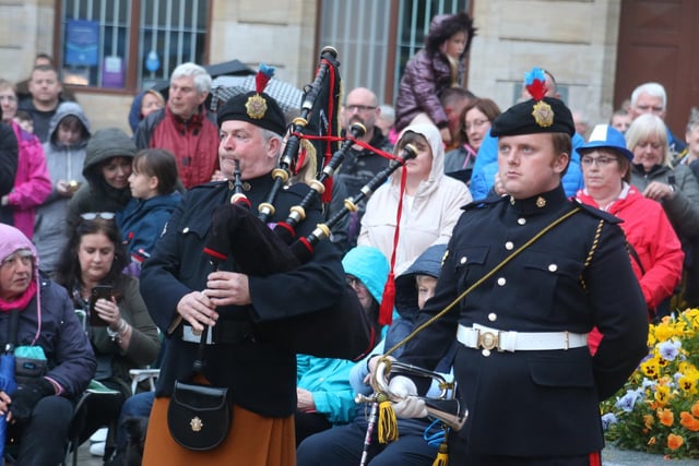 Crowds gather behind piper Robert Bratty as he plays ‘Diu Regnare’ (long to reign), composed as a tribute to Queen Elizabeth II for her dedication and service to the Commonwealth, alongside bugler David Granleese at the Platinum Jubilee beacon lighting event in Coleraine