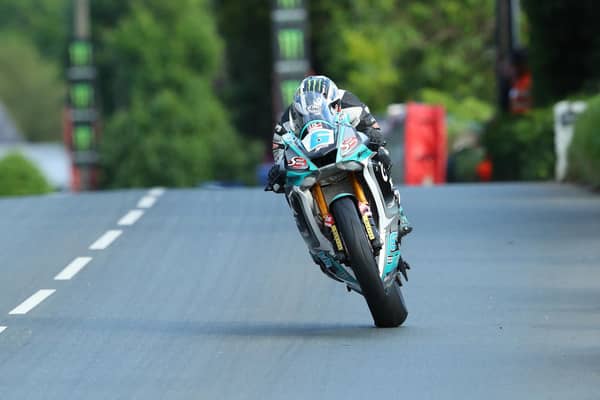 Michael Dunlop won Monday's opening Supersport race on his MD Racing Yamaha and set a new lap record at 129.45mph.