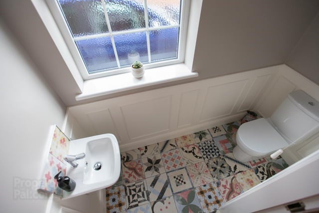 The cloakroom with stylish flooring.