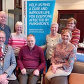 Jimmy McClean standing left,  pictured with committee members of the   Ballymena and District Branch of Parkinson's UK of which he is chairperson, and the Mayor of Mid and East Antrim, Councillor William McCaughey, who hosted them at a reception lunch