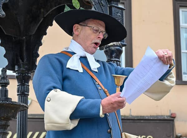 Carrick Town Crier Godfrey Robinson reading the official proclamation of the Platinum Jubilee events.
