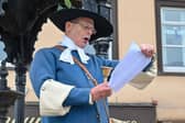 Carrick Town Crier Godfrey Robinson reading the official proclamation of the Platinum Jubilee events.