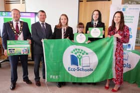 Mayor of Antrim and Newtownabbey, Cllr Stephen Ross and Keep Northern Ireland Beautiful Chief Executive Dr Ian Humphreys present Glengormley High School staff and pupils with their Green Flag awards.