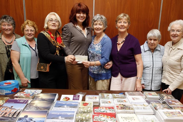 Laura Thompson, regional fundraiser, is presented with a £8500 cheque from committee of Portstewart Hospice Support Group during their annual coffee morning and sale held at the Star of the Sea Parish Centre in September 2010. From left are, Mary Elliott, Yvonne Alcorn, Iris Jamieson, chairperson, Barbara Lafferty, treasurer, Joan Wright, secretary, Nan Bacon and Ann Crory