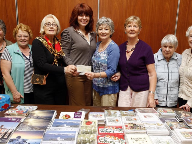 Laura Thompson, regional fundraiser, is presented with a £8500 cheque from committee of Portstewart Hospice Support Group during their annual coffee morning and sale held at the Star of the Sea Parish Centre in September 2010. From left are, Mary Elliott, Yvonne Alcorn, Iris Jamieson, chairperson, Barbara Lafferty, treasurer, Joan Wright, secretary, Nan Bacon and Ann Crory