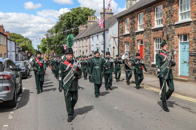The Band of the Royal Irish Regiment lead the Standards and Members of the Royal British Legion through the streets of Royal Hillsborough. Pic by Norman Briggs, rnbphotographyni