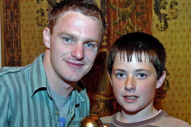 Coagh Youth U13 Player of the Year Mathew Rollins receives his award from Coagh Utd senior player Jamie Tomelty in 2007.