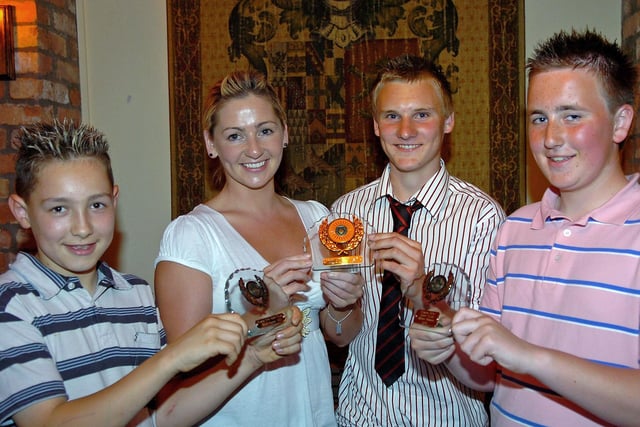 Coagh Utd Supporters Club U13, U15, and U17 Players Of the Year Peter Gilkinson, James Johnston and Daniel Kane with Carla Dallas at the club's youth presentation night in 2007.