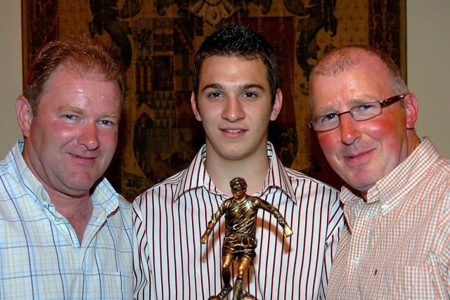 Neil Smyth, Coagh Youth U17 Most Improved Player of the Year, receives his award from managers Alan Dallas and Barry Ramsey back in 2007.