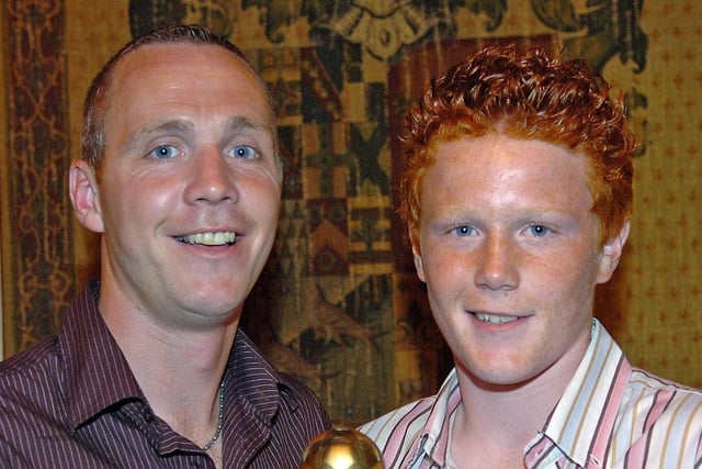 Coagh Youth U15 Player Of the Year Stephen Glasgow receives his award from Coagh Utd senior player Mark McMenemy. in 2007.