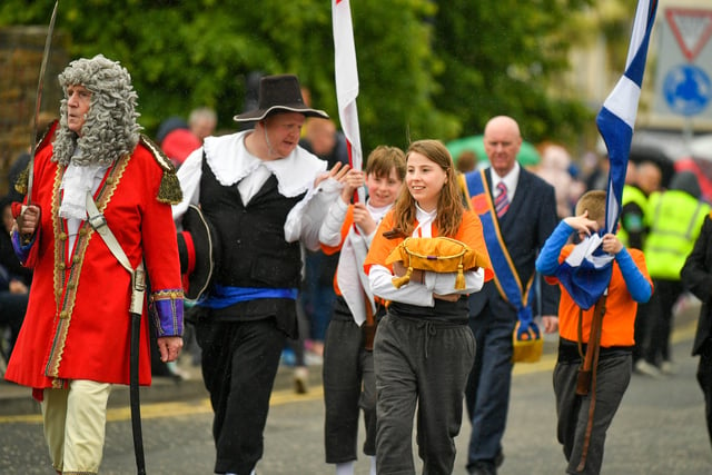 The parade makes its way through the streets of Carrickfergus. Picture: Andrew McCarroll/ Pacemaker Press