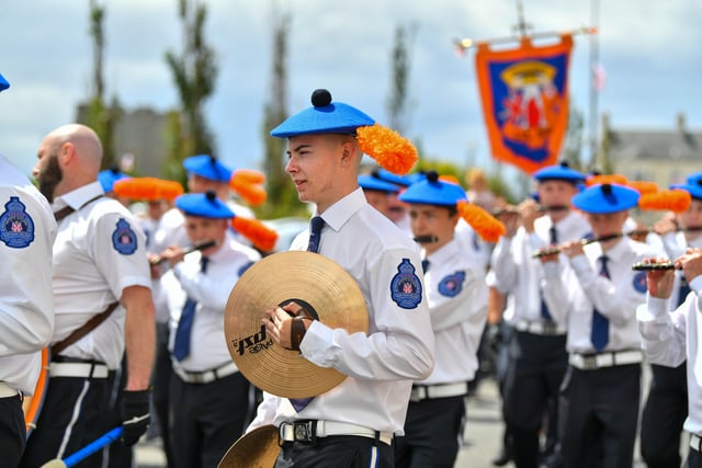 Band members keep in step during the colourful parade. Picture: Andrew McCarroll/ Pacemaker Press
