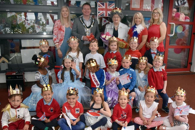 Mayor of ABC Council, Councillor Glenn Barr and 'The Queen' pictured with Nursery class 2 pupils and staff back from left, Mrs Claire Savage, teacher, Mrs Lisa McCreanor and Miss Ciara O'Brien, nursery assistants. INPT22-226.