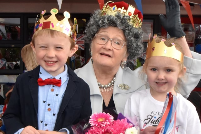 Queen For A Day... Mrs Iris Mullen who played the part of The Queen for the Millington Nursery School Jubilee Party pictured with pupils, Archie Wright and Aurora Teggart. INPT22-227.