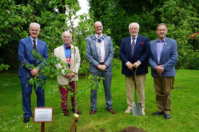Ulster New Zealand Trust Patron Brian McKnight, with spade, planted a Queen’s Green Canopy tree at The Ballance House near Glenavy to mark the Platinum Jubilee. Also included, from left, Cllr Wm Beckett, Lisburn CCC, Trust director David Twigg, LCCC Deputy Mayor Tim Mitchell and UNZT director Freddie Hall