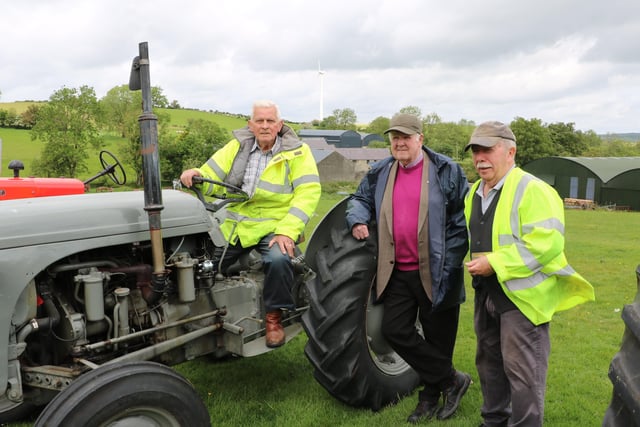 Discussing the route of the Charity Tractor Run are Gordon Clarke - seated on his 1952 PT Ferguson - and Tommy Spratt with Peter McGrady a member of the Dromara Vintage and Classic Club, the organisers of the event