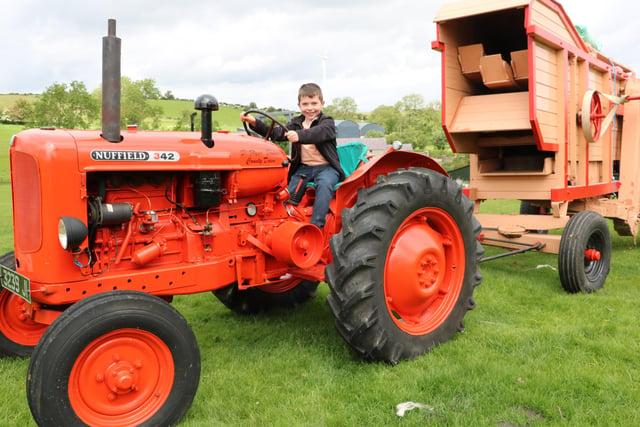 Nine-year old Jack Glass from Dromara is  already an aspiring tractor owner as he play drives his grandfather's Nuffield 342 prior to the start of the Dromara Vintage and Classic Club tractor run in aid of the Daisy Lodge centre for children with cancer.