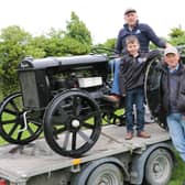 One of the rarest pieces of machinery on display at last week's Dromara Tractor Run in aid of the Daisy Lodge centre for children with cancer was this 1936 Ferguson Brown tractor. Daniel Flynn is in the driving seat accompanied by his nephew Jack Glass and Claragh Bridge Show committee member Paddy Murray.