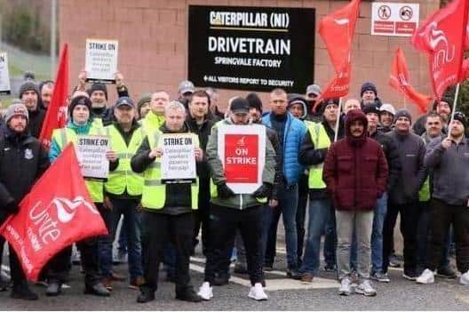 Employees and Unite union members on an earlier picket at Caterpillar's west Belfast plant. Picture: Jonathan Porter/PressEye.
