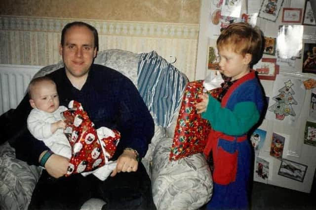 David with Louie and Joshua as they celebrate Christmas  Constable Johnston was murdered in Church Walk, Lurgan 25 years ago.