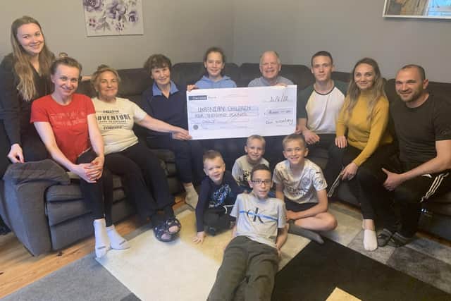 Don Woolsey, who owns a shop in Portadown, handed over a cheque for £4,000 to the Ukranian Children's Appeal.