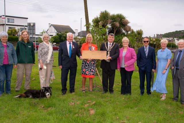 Pictured is The Deputy Lord-Lieutenant of County Antrim, Mrs Jackie Stewart MBE and Mayor of Mid and East Antrim, Alderman Noel Williams with the volunteers of Brighter Whitehead, Led by Bill Pollock at the plaque unveiling, in Whitehead.