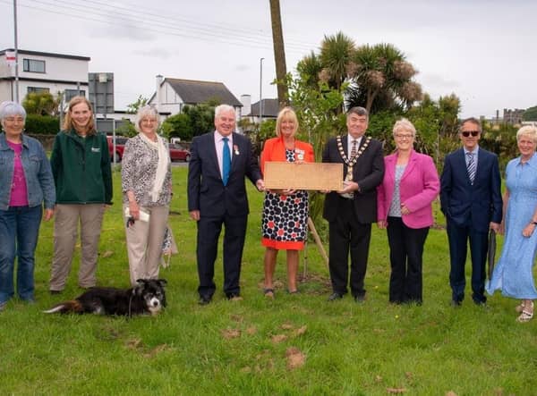 Pictured is The Deputy Lord-Lieutenant of County Antrim, Mrs Jackie Stewart MBE and Mayor of Mid and East Antrim, Alderman Noel Williams with the volunteers of Brighter Whitehead, Led by Bill Pollock at the plaque unveiling, in Whitehead.