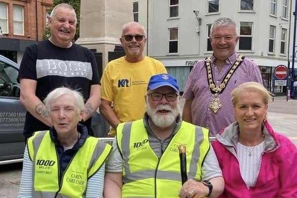 Caring Caretaker Davy Boyle and his wife Teresa (front row) were joined on their charity walk by the Mayor of Causeway Coast and Glens, Cllr Ivor Wallace (back right). Also walking with Davy were his brother Nevin and Denis and Helen McNeill