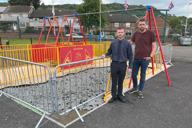 Macedon Councillor Matthew Brady and Phillip Brett MLA beside the damaged children's swings area.