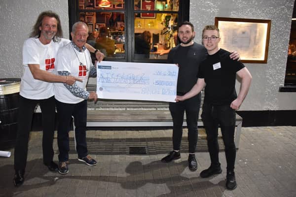 (l-r)  Willie Gregg and Raymond Pollock, both members of the Northern Ireland Children to Lapland and Days to Remember Trust’s North Coast Fundraising Committee receive a donation cheque of £500 from Ramore Restaurant Portrush General Manager Arnie Boreland and Gin Bar Manager Jordan McClenaghan as part of Ramore Restaurant’s commitment to local charities