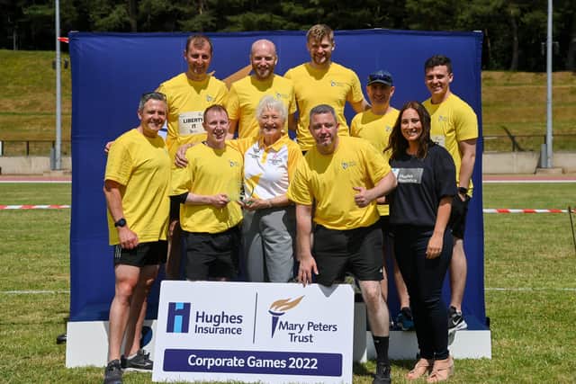 Pictured are Lady Mary Peters with first place award winners Liberty IT and Kirsten Gowdy, internal controls analyst at Hughes Insurance on the right at the recent inaugural Mary Peters Trust corporate games