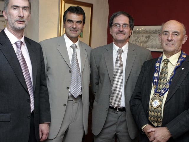 TO THE FOUR. Ray O'Brien (2nd right), who has retired from St Brigid's PS Ballymoney, pictured at a function held on his behalf on Friday night at Drumadoon House along with Gerry Doran, (Chair of Board of Governors), George McVeigh, (Principal of neighbouring Model PS) and Deputy Mayor, Cllr Harry Connolly.BM26-094SC.