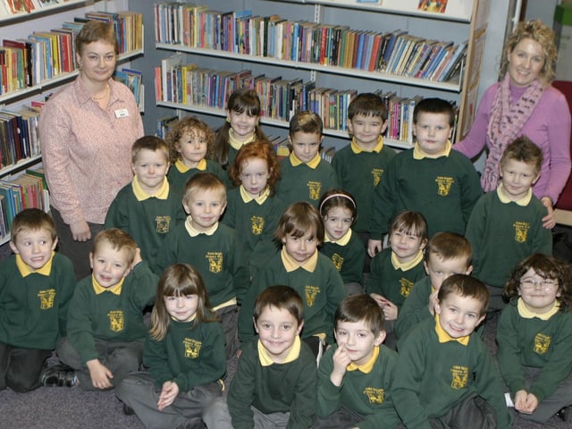 STORYTIME. Leah Tweed, (Ballymoney Library), pictured along with pupils from St Brigid's PS, Ballymoney, who received their Book Time packs on Thursday. Included is Teacher Miss Stewart.BM48-022SC.