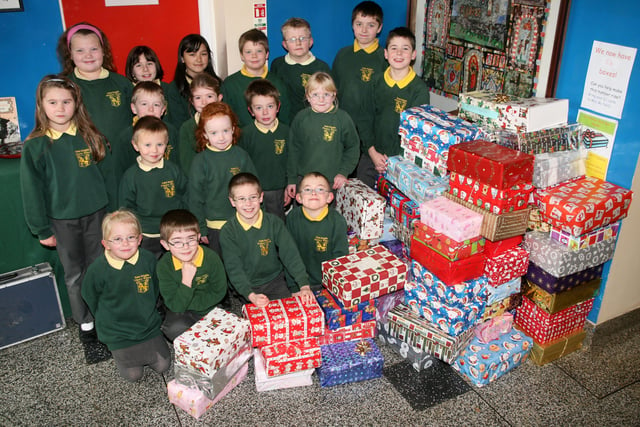 Pupils from St. Brigid's PS (Ballymoney) with a selection of their shoe boxes for the Road of Hope charity. BM48-601AC