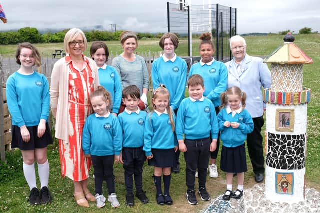 Baroness May Blood pictured with artist Shauna McCann, principal Denise Macfarlane and pupils at the Corran Integrated Primary School garden.