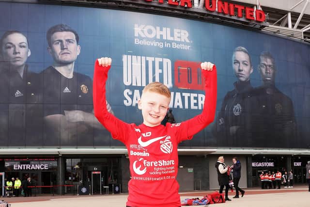 Ben Dickinson pictured after completing his 10-day trek to Old Trafford.