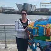 Julie pictured with the Elmer she decorated.