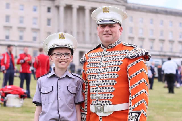 Kenny Ferguson with his 13-year-old son Jamie from Cookstown Sons of William Flute Band pictured at the Grand Orange Lodge of Ireland-organised NI Centenary event at Stormont.  Picture: Jonathan Porter/PressEye
