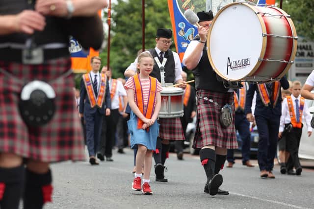 A young member of Benagh LOL 302 walking with Altnaveigh Pipe Band in the 2021 parade in Newry. Picture: Philip Magowan / PressEye