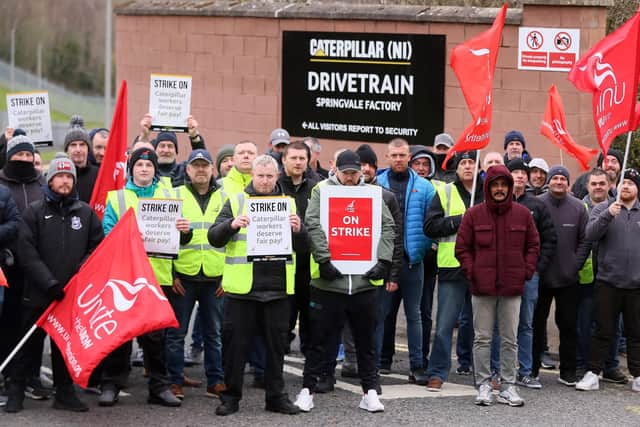 Caterpillar Northern Ireland employees and Unite union members form a picket at the company's Belfast plant. Picture by Jonathan Porter/PressEye