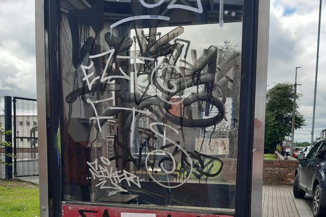 Graffiti covers a telephone kiosk in Portadown, Co Armagh.