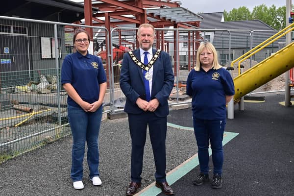The Mayor of Antrim and Newtownabbey, Ald Stephen Ross with Gemma Jackson and Doreen Beattie (Rathfern Community Regeneration Group Ltd).