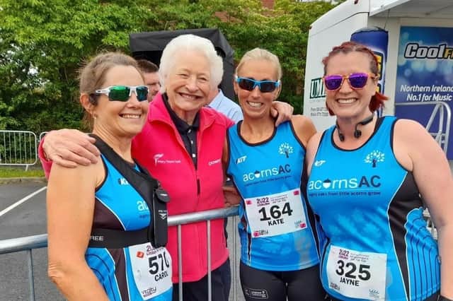 Dame Mary Peters share smiles and encouragement with Carol, Kate and Jayne ahead of Lisburn Half Marathon